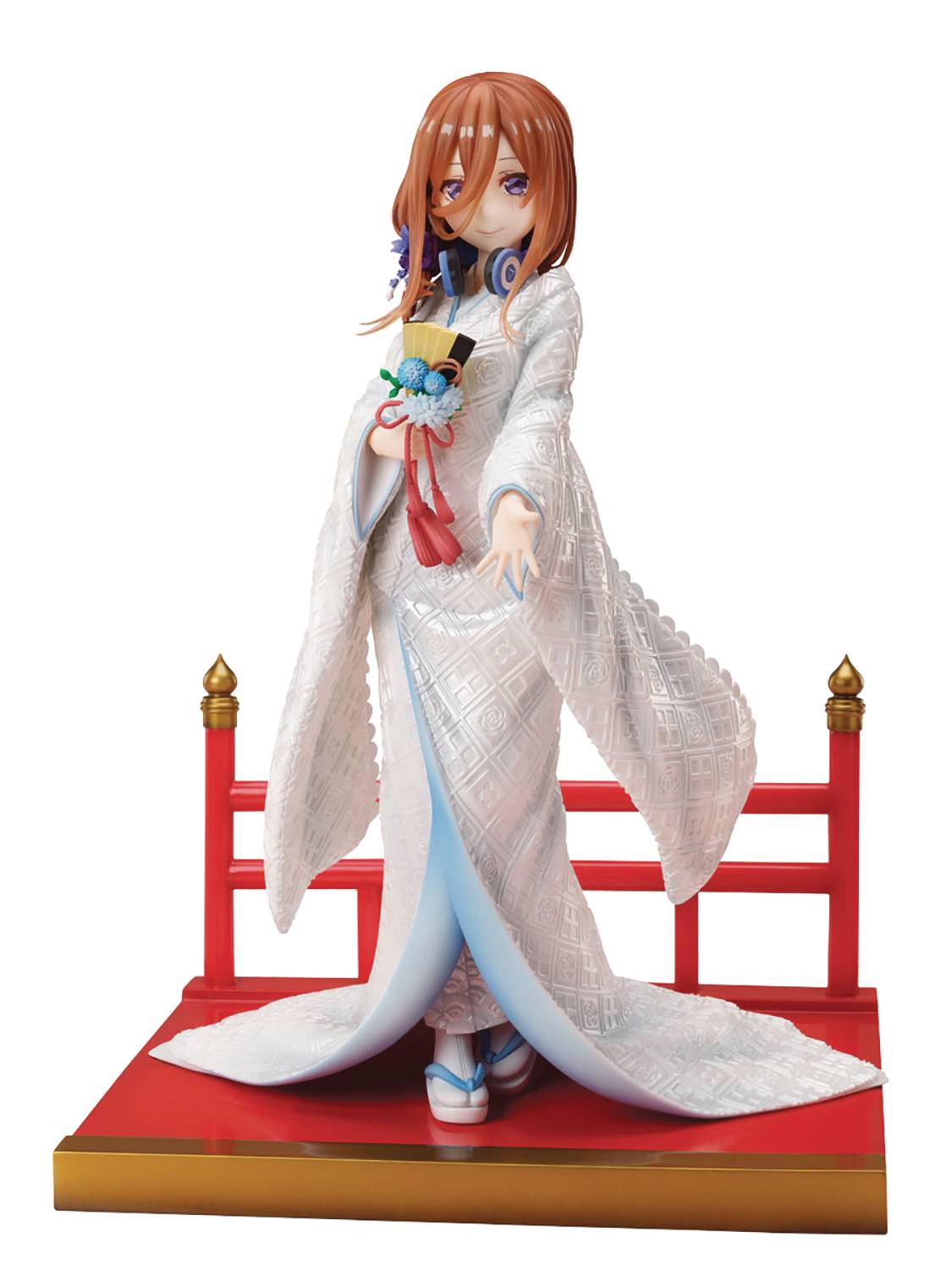 Dessed in a traditional wedding kimono, the shy Miku is pictured holding a ...